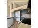 Modern kitchen with dark green cabinets and stainless steel appliances at 6891 W Via Del Sol Dr, Glendale, AZ 85310
