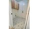 Laundry room with stylish geometric floor and wooden cabinets at 6891 W Via Del Sol Dr, Glendale, AZ 85310
