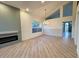 Open living room featuring hardwood floors and a modern fireplace at 6891 W Via Del Sol Dr, Glendale, AZ 85310