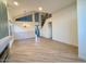 Spacious living area with high ceilings and an elegant chandelier at 6891 W Via Del Sol Dr, Glendale, AZ 85310