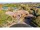 Breathtaking aerial view of this desert estate near a golf course and surrounded by lush greenery at 10742 E Greythorn Dr, Scottsdale, AZ 85262