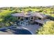 Expansive home showcasing pristine golf course views, desert landscape, and tile roof at 10742 E Greythorn Dr, Scottsdale, AZ 85262