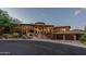 Stunning single-story home with porte-cochere, mature desert landscaping, and three-car garage at 10742 E Greythorn Dr, Scottsdale, AZ 85262