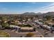 Panoramic aerial view of neighborhood with mountain backdrop showcasing desert homes and landscaping at 10801 N 45Th St, Phoenix, AZ 85028