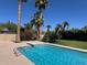 Sparkling pool featuring palm trees and lush landscaping creating a serene backyard oasis at 10801 N 45Th St, Phoenix, AZ 85028