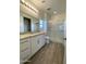 Main bathroom with double vanity, large shower and tile floor at 12723 W Carousel Dr, Arizona City, AZ 85123