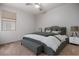 Bedroom with a king-size bed and bench at the foot at 13015 W Highland Ave, Litchfield Park, AZ 85340