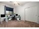 Home office with two desks, computers and built in storage at 13015 W Highland Ave, Litchfield Park, AZ 85340