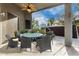 Covered patio with outdoor dining set and ceiling fan at 13015 W Highland Ave, Litchfield Park, AZ 85340