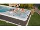 Gathering enjoying a relaxing soak in the backyard spa at 13015 W Highland Ave, Litchfield Park, AZ 85340