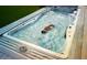 Luxury backyard swimming pool with swim jets and spa features at 13015 W Highland Ave, Litchfield Park, AZ 85340