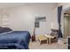 Bedroom with a bed, chair, and guitar at 170 E Guadalupe Rd # 14, Gilbert, AZ 85234