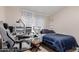 Cozy bedroom with a bed, desk, and comfortable chair at 170 E Guadalupe Rd # 14, Gilbert, AZ 85234