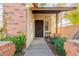 Front entrance with brick accents and landscaping at 170 E Guadalupe Rd # 14, Gilbert, AZ 85234