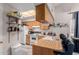 Kitchen boasts wood cabinets, white appliances, and a breakfast bar at 170 E Guadalupe Rd # 14, Gilbert, AZ 85234