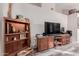 Living room with entertainment center and shelves at 170 E Guadalupe Rd # 14, Gilbert, AZ 85234