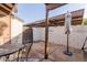Small patio with table, chairs, and umbrella at 170 E Guadalupe Rd # 14, Gilbert, AZ 85234
