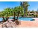 Community pool area with lush landscaping at 170 E Guadalupe Rd # 14, Gilbert, AZ 85234