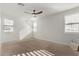 Bright bedroom with carpeted floor and large windows at 21211 W Minnezona Ave, Buckeye, AZ 85396