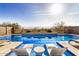 Relax by the refreshing pool with lounge chairs and a stunning view at 21211 W Minnezona Ave, Buckeye, AZ 85396