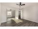 Bedroom with mirrored closet doors and ceiling fan at 22312 W Hammond Dr, Buckeye, AZ 85326