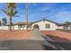 Single story home with a landscaped yard and palm trees at 22312 W Hammond Dr, Buckeye, AZ 85326