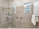 Bathroom with a large walk-in shower and built-in shelving at 4825 N 205Th Gln, Buckeye, AZ 85396