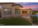 Home with a pool and landscaped backyard at sunset at 501 E Sunburst Ln, Tempe, AZ 85284