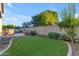 Landscaped backyard with artificial turf and a relaxing atmosphere at 501 E Sunburst Ln, Tempe, AZ 85284