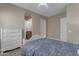Well-lit bedroom with a queen-size bed and built-in dresser at 501 E Sunburst Ln, Tempe, AZ 85284