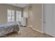 Comfortable bedroom with a dresser and access to a bathroom at 501 E Sunburst Ln, Tempe, AZ 85284