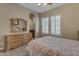 Bedroom with dresser, mirror and ensuite bathroom access at 501 E Sunburst Ln, Tempe, AZ 85284
