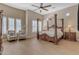 Main bedroom with a large four poster bed and ceiling fan at 501 E Sunburst Ln, Tempe, AZ 85284