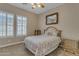 Bright bedroom with a floral comforter, and built-in dresser at 501 E Sunburst Ln, Tempe, AZ 85284