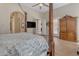 Main bedroom with four-poster bed and ceiling fan, view of walk-in closet at 501 E Sunburst Ln, Tempe, AZ 85284