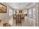 Open dining area with hardwood floors and a view to the kitchen at 501 E Sunburst Ln, Tempe, AZ 85284