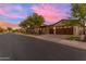 Home's exterior at sunset, with a wooden garage door at 501 E Sunburst Ln, Tempe, AZ 85284