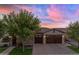 Stunning house exterior with wooden garage doors at 501 E Sunburst Ln, Tempe, AZ 85284