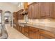 View of kitchen with granite countertops, stainless steel appliances, and custom cabinetry at 501 E Sunburst Ln, Tempe, AZ 85284