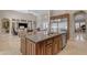 Granite kitchen island, stainless steel appliances, and open layout at 501 E Sunburst Ln, Tempe, AZ 85284