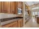 Kitchen with granite countertops, stainless steel appliances, and custom cabinetry at 501 E Sunburst Ln, Tempe, AZ 85284