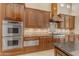 Spacious kitchen with granite countertops, stainless steel appliances, and custom cabinetry at 501 E Sunburst Ln, Tempe, AZ 85284