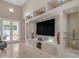 Living room with built-in entertainment center and access to backyard at 501 E Sunburst Ln, Tempe, AZ 85284
