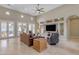Open living area with high ceilings, a large TV, and access to a backyard patio at 501 E Sunburst Ln, Tempe, AZ 85284