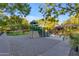 Community playground with playset, sand area, and shaded seating at 501 E Sunburst Ln, Tempe, AZ 85284