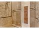 Large walk in shower with tiled walls and built in seat at 501 E Sunburst Ln, Tempe, AZ 85284