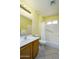The bathroom is well-lit with a sink, toilet, bathtub and shower features at 11250 E Kilarea Ave # 252, Mesa, AZ 85209