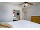 Bright bedroom with a ceiling fan, mirrored closet, and a chest of drawers at 11250 E Kilarea Ave # 252, Mesa, AZ 85209