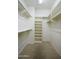 Walk-in closet with shelving and clothes rods for ample storage at 11250 E Kilarea Ave # 252, Mesa, AZ 85209
