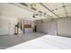 Spacious garage featuring ample storage cabinets, water heater, and a water softener system at 11250 E Kilarea Ave # 252, Mesa, AZ 85209